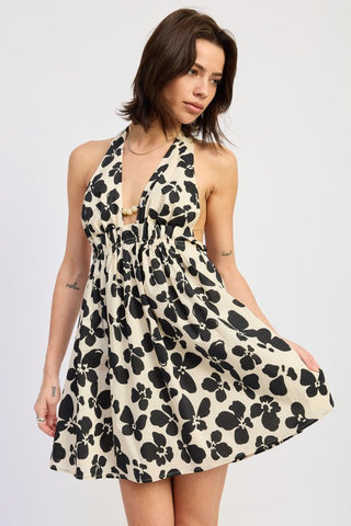 back view ivory black graphic print halter mini dress showing tie at neck and open back