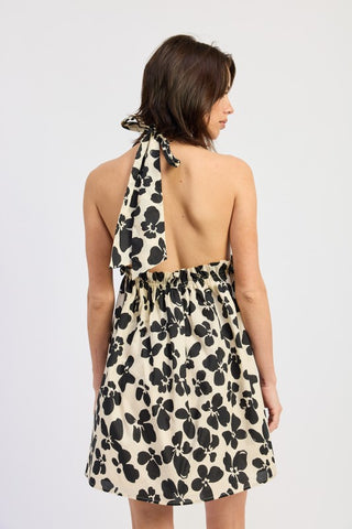 lifestyle shot Wren cinched waist graphic print halter mini dress showing overall length and fit