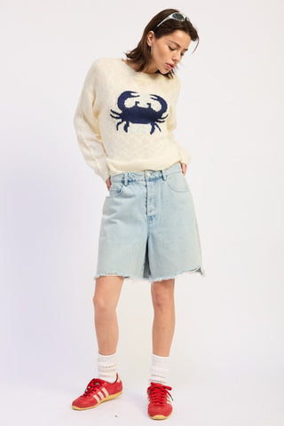 back view cream slub knit crab intarsia sweater showing standard back construction and relaxed boxy fit from behind