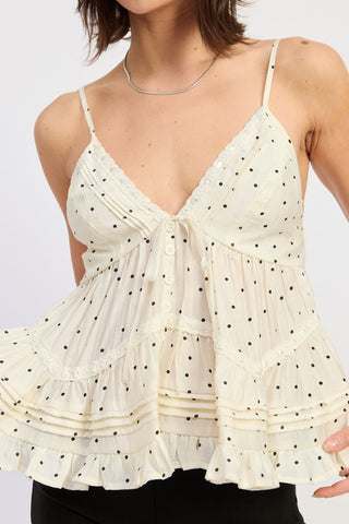 side view ivory polka dot ruffle cami top showing pintuck tier detail and hip length