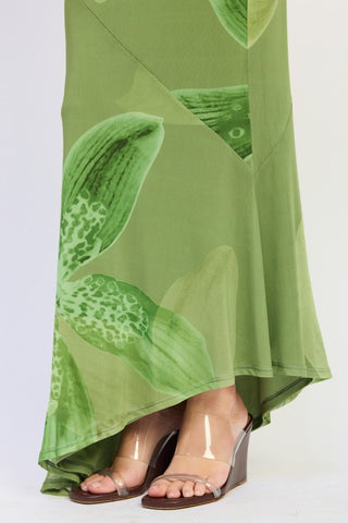 close-up lower skirt detail tonal green orchid print mesh mermaid skirt showing flared hem and macro botanical scale