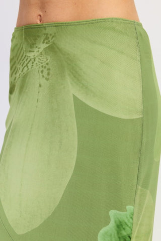 side view tonal green botanical mesh maxi mermaid skirt showing fitted hip through flared hem silhouette