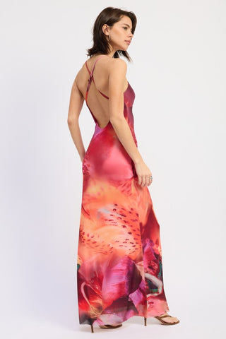 detail shot botanical placement print on floral halter maxi dress showing large-scale tropical flower motif