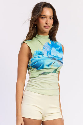 full front model in sage green floral mesh crop top with ivory shorts showing complete look and gold earring