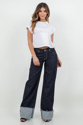 Side profile dark rinse wide leg jeans contrast cuff floor sweep low rise GJG