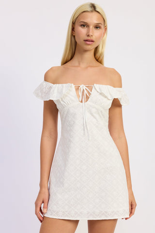 Woman wearing a white off-shoulder dress on a light purple background