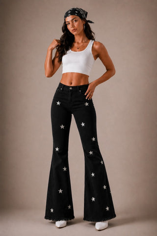 Side profile black low rise flare jeans dramatic bell flare star rhinestone