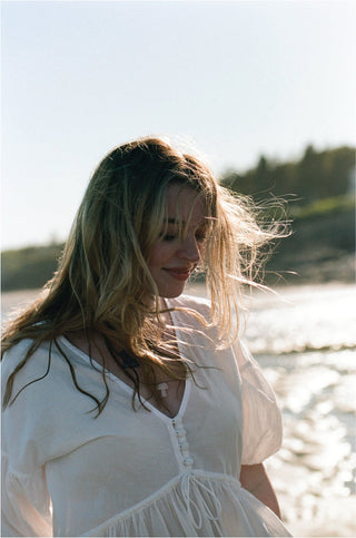 solid (likely) Poet Puff Sleeve Wrap Mini Dress — lifestyle shot