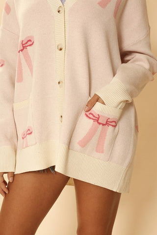 All Over Bow Knit Cardigan from Knit Cardigan collection you can buy now from Fashion And Icon online shop